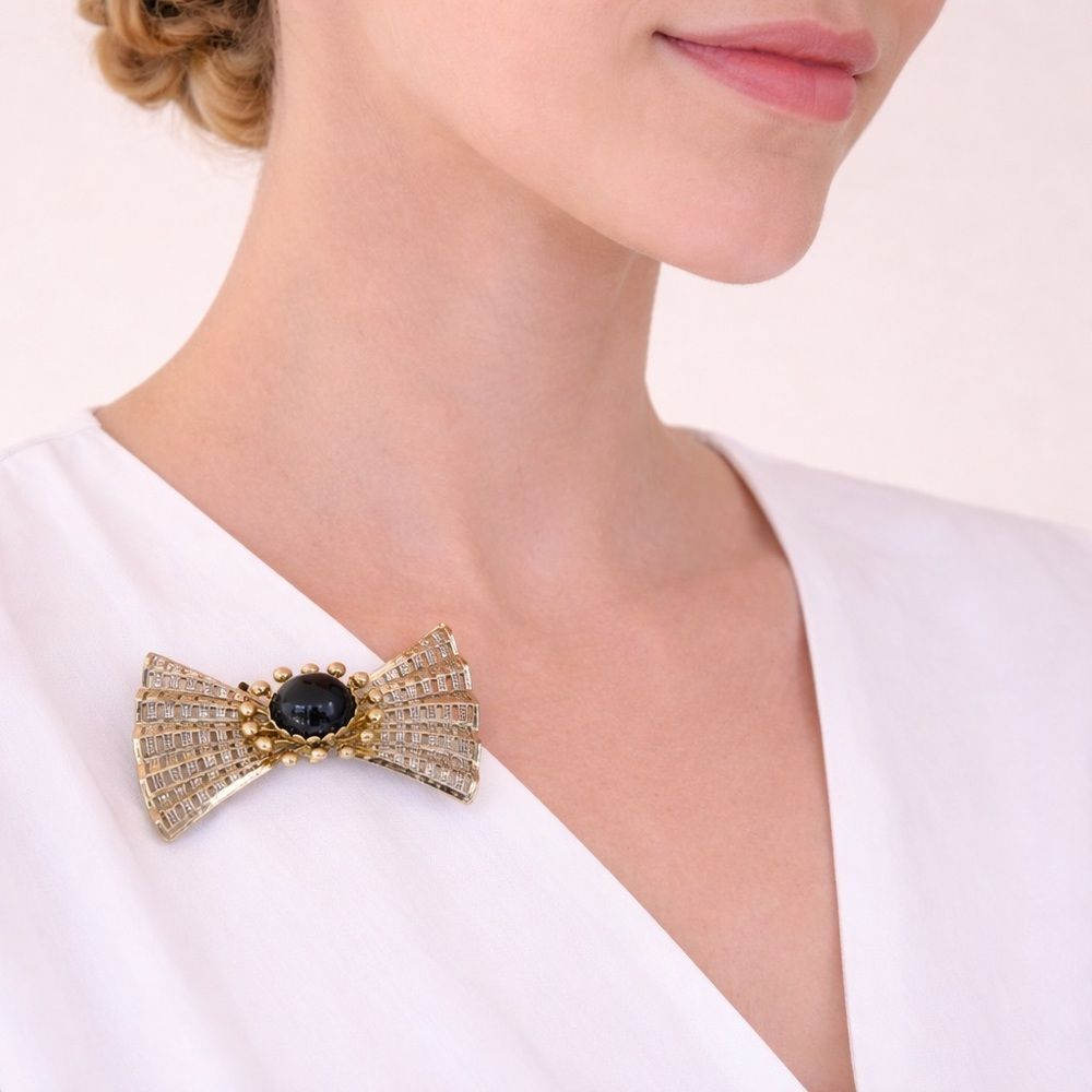 Elegant Gold and Black Bow Brooch